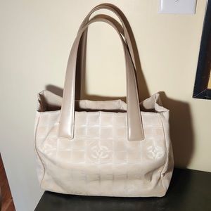 Authentic Chanel travel tote beige nylon w. beige leather handles Very good cond